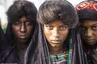 fulani teen swimming with man in naked
