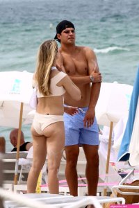 anna louise shows off her sexy body in a green bikini on the beach in miami