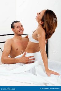 Man with wife having sex stock photo. Image of bedroom