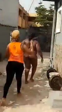 Fat Nigerian Lady With Big Breasts Stripped Naked And Beaten In Public After Allegedly Getting Caught Cheating