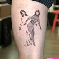 Blackwork style nude women tattooed on the thigh.