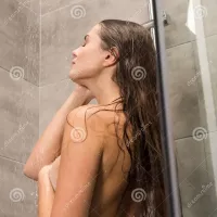 Girl Taking Shower and Covering Breast Stock Photo