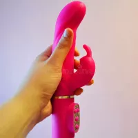 Female Hand Holding Pink Vibrator Sex Toy Stock Image