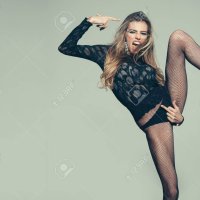 Sexy Woman Shows Fuck Gesture On Her Panties. Obscene Concept. Girl In Lace Top And Underwear Tights In Black Panties. Hand Touching Pubis In Fuck Gesture. Impudent Lady Looks Attractive Hot Sexy.