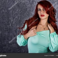 Fashion portrait of redhead model posing near gray wall girl with big tits in a tight dress Stock Photo sandy-che.yandex.ru 147198645