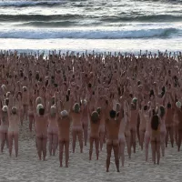 Bondi becomes nude beach as thousands take part in Spencer Tunicks Sydney installation