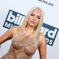 Karol G Wears Wet Look Dress on Billboard Music Awards 2023 Red Carpet