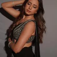 Sargun Mehta raises heat with her sultry avatar in this black high slit saree