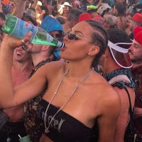 Liz Cambage parties at a festival in nothing but a black G-string and crop top