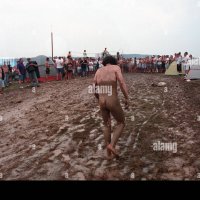 Naked nude man covered in mud Woodstock Music Festival 1994 USA Stock Photo