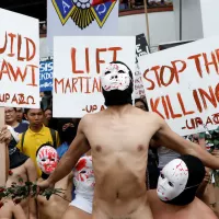 Skin in the game: Philippine students protest Duterte in naked run