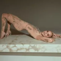 Khloé Kardashian rocks nude catsuit covered in tattoos