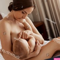 Young Tender Nude Mother Breastfeeding Hugging Stock Photo 657764923