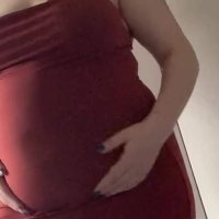 Round fat belly in a red dress