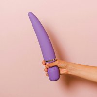 Hand Holding a Vibrator Free Stock Photo