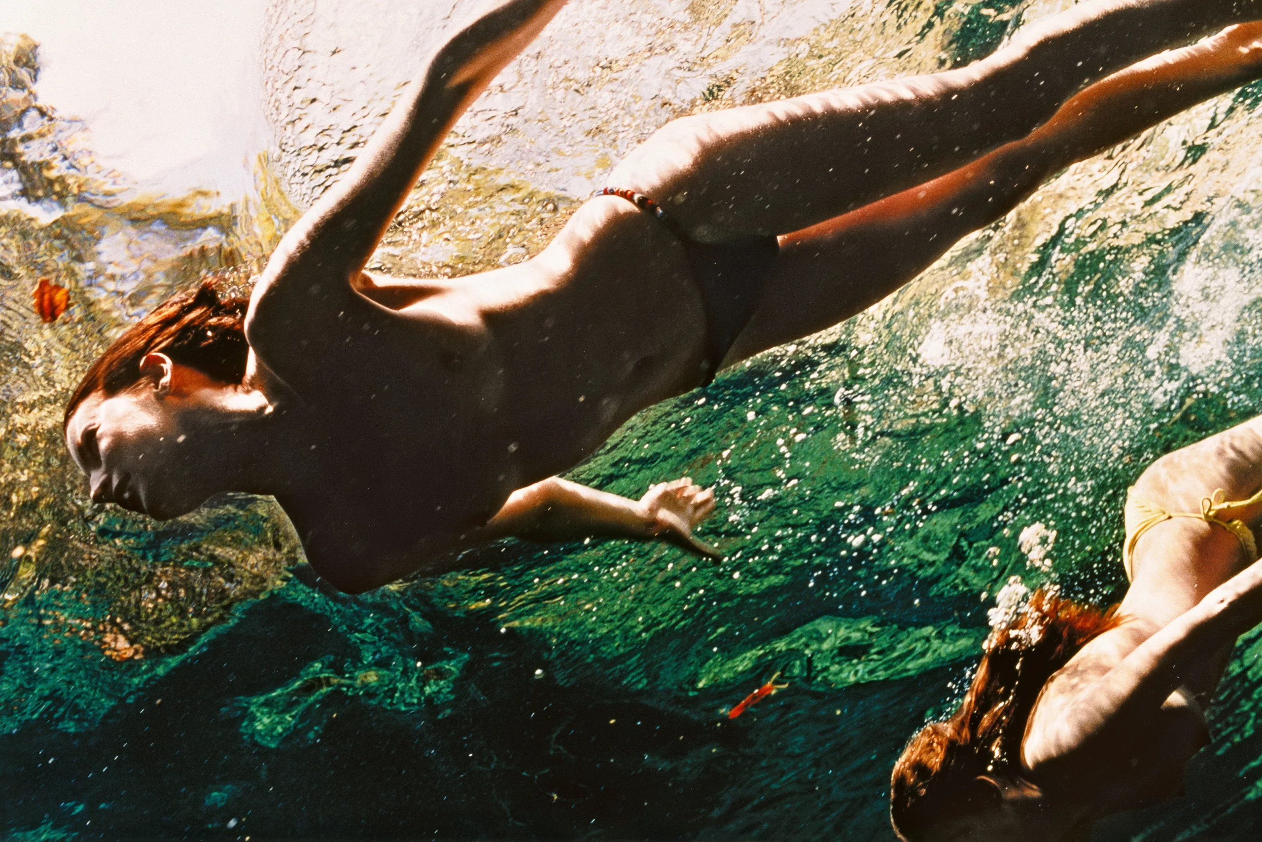 Naked couple swim