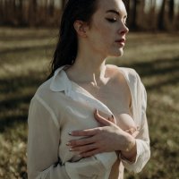 Young Partly Dressed Woman Covering her Breasts with Hands Free Stock Photo