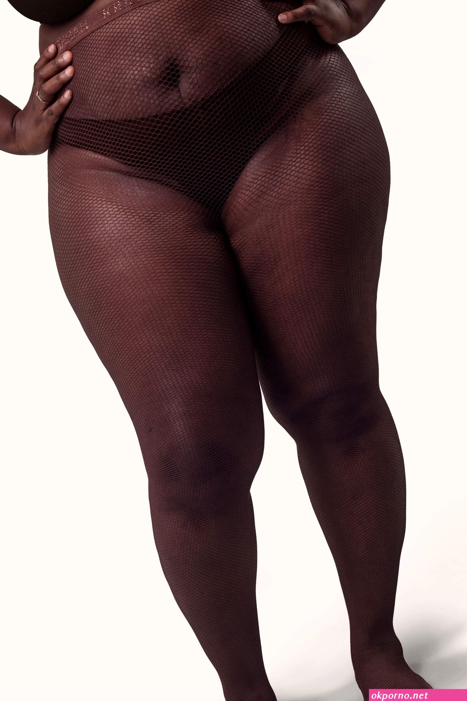 Nude in fishnets